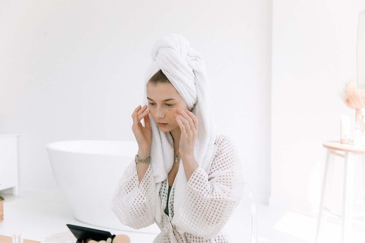 woman using an anti aging face mask